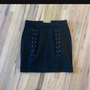 Small fits like an extra small. Black suede mini skirt. Never worn